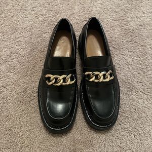 Black leather shoes w/ gold strap